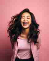 Vector portrait of happy young asian woman laughing isolated over pink background stock photo