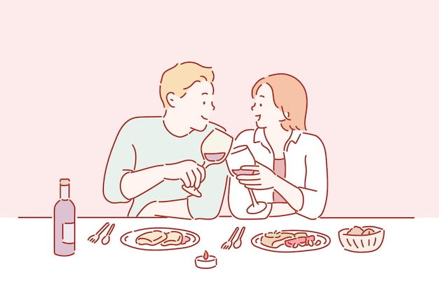 와인을 마시는 레스토랑 테이블에 앉아 데이트에 사랑에 빠진 젊은 부부의 초상화