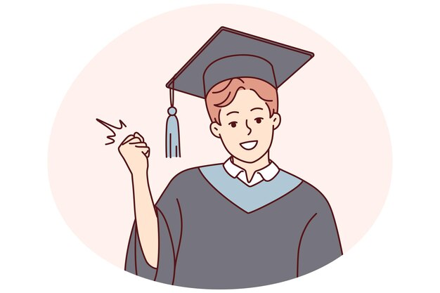 Portrait of smiling male student in mantle and hat make yes hand gesture for successful