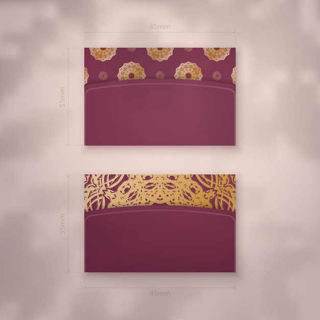 Presentable business card in burgundy color with luxurious gold ornaments for your business.