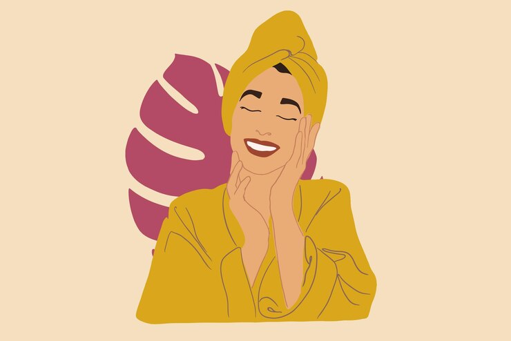 Pretty woman relaxing in bathrobe and towel