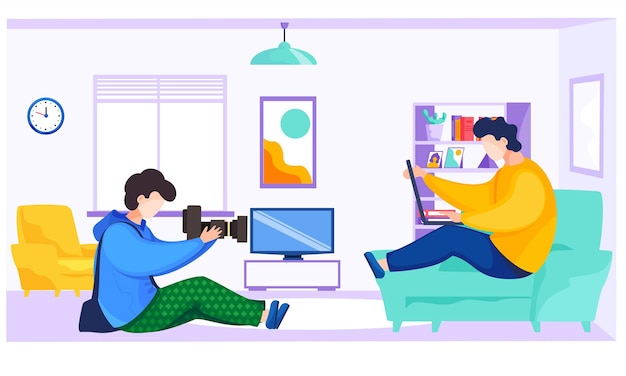 Professional photographer makes pictures of a guy sitting on the sofa with a laptop Man with the camera takes pictures of the male freelancer Shooting in apartment A photo session at home