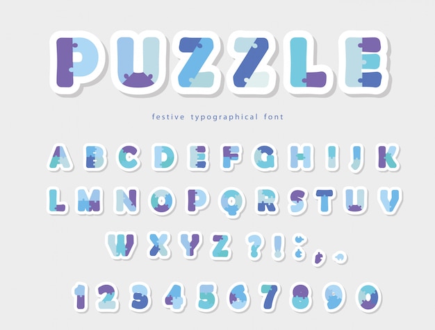 Puzzle paper cut out font in blue colors.