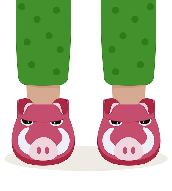 Pyjamapantoffels voor kinderen. kinderen voeten in grappige pantoffels. stier pantoffels