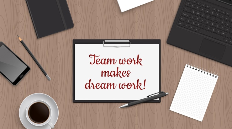 Vector quote team work make dreamwork in tablet on office table