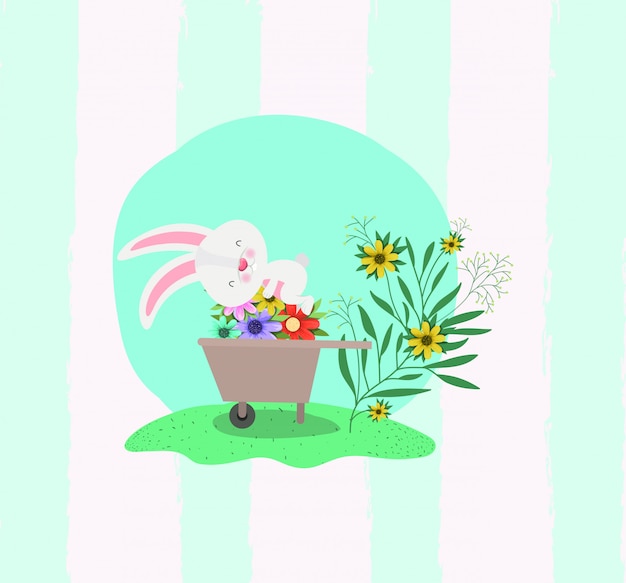 Rabbit and wheelbarrow with flowers in the garden