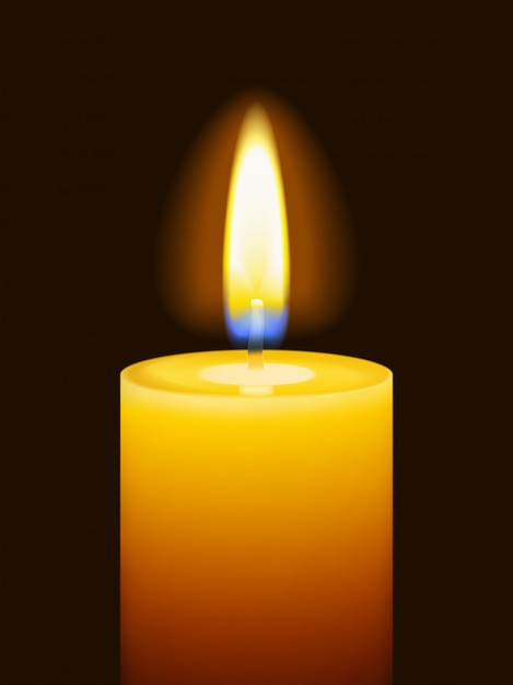 Realistic burning yellow candle on dark