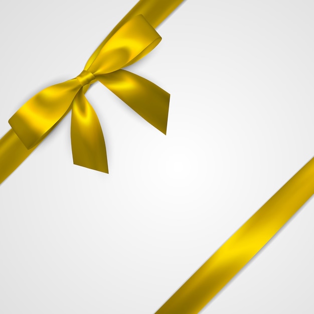 Realistic golden bow with yellow ribbons isolated on white