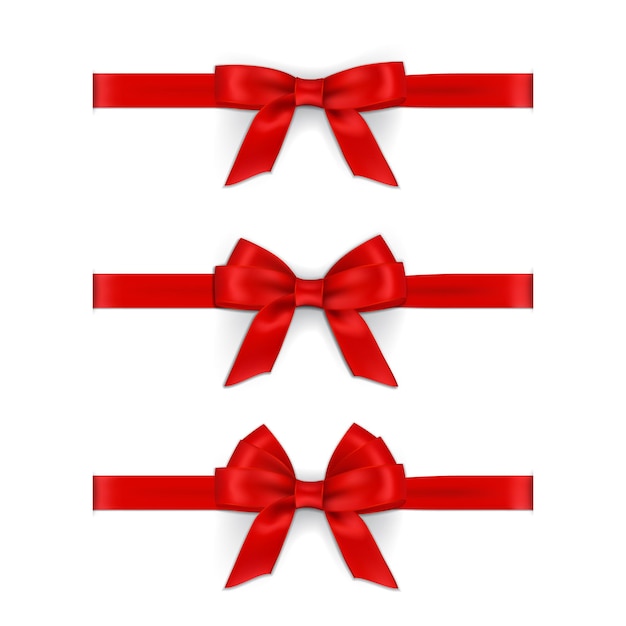 Realistic red ribbons and bows isolated on white background.