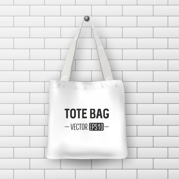 Tote bag in tessuto bianco realistico di vettore. primo piano sul fondo del muro di mattoni. modello di progettazione per il branding, mockup. eps10 illustrazione.