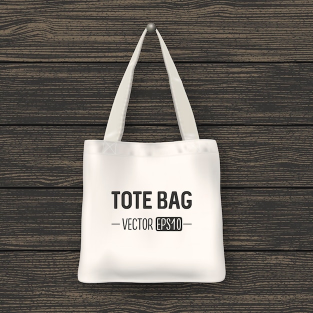 Tote bag in tessuto bianco realistico di vettore. primo piano su uno sfondo di legno. modello di progettazione per il branding, mockup. eps10 illustrazione.