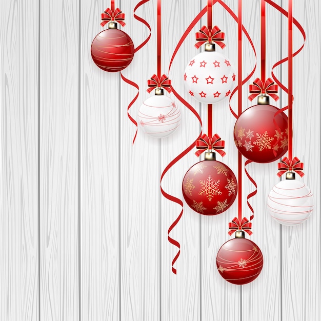 Red Christmas balls on wooden background