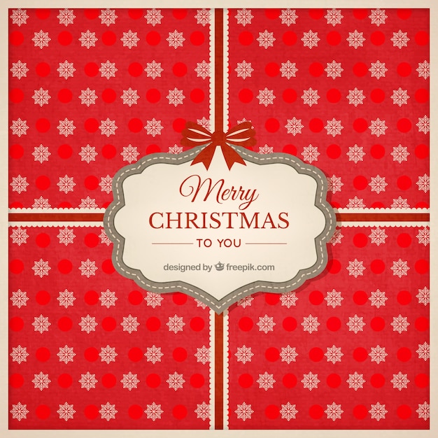 Red christmas gift with snowflakes background