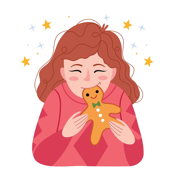 Red-haired girl eats a gingerbread man. winter mood.