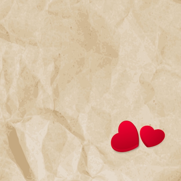 Vector red hearts on vintage paper background with copyspace.