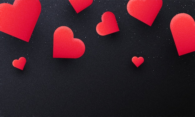 Red paper hearts on black background