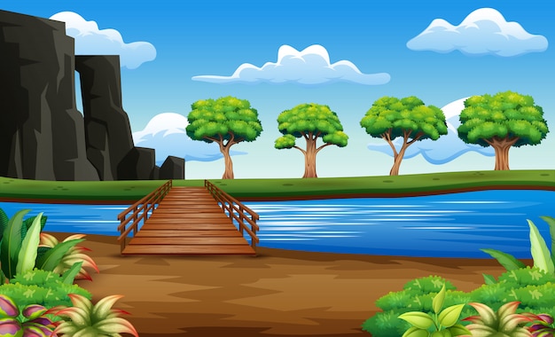 Река и деревянный мост на фоне красивой природы