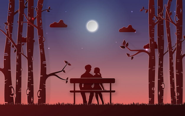 ロマンチックなカップルは月を見てベンチに座っています。