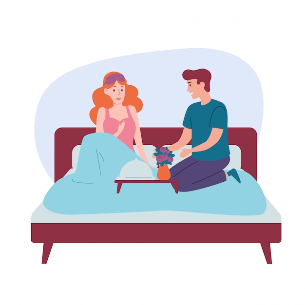 Romantic happy couple having breakfast in bed