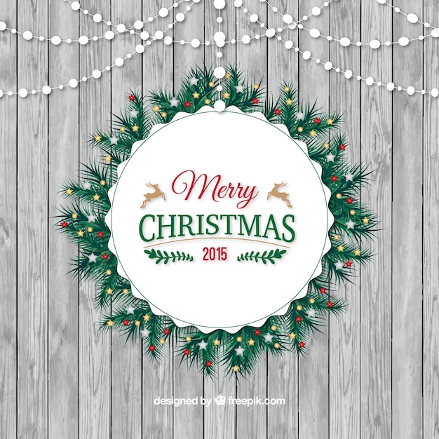 Rounded christmas wreath on a wood texture background