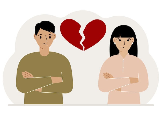 sad man and woman next to a broken red heart broken heart