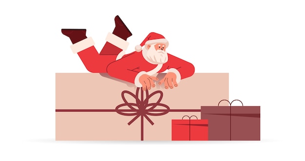 Santa claus in red costume lying on wrapped gift boxes happy new year merry christmas holidays celebration concept