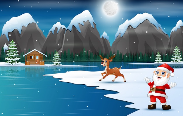 Santa claus with reindeer at winter landscape