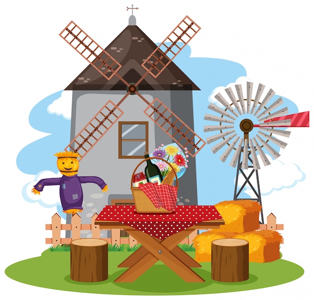 Scene with windmill tower and food on the picnic table