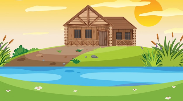 scene with wooden cottage in the field at sunset