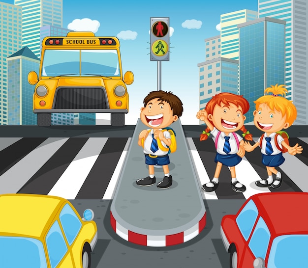 都市の街を横断する学校の子供たち