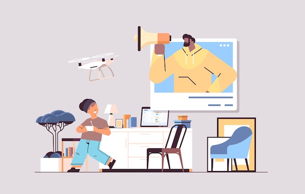 schoolboy controlling air drone with wireless remote controller boy with african american man in web browser window having fun living room interior 