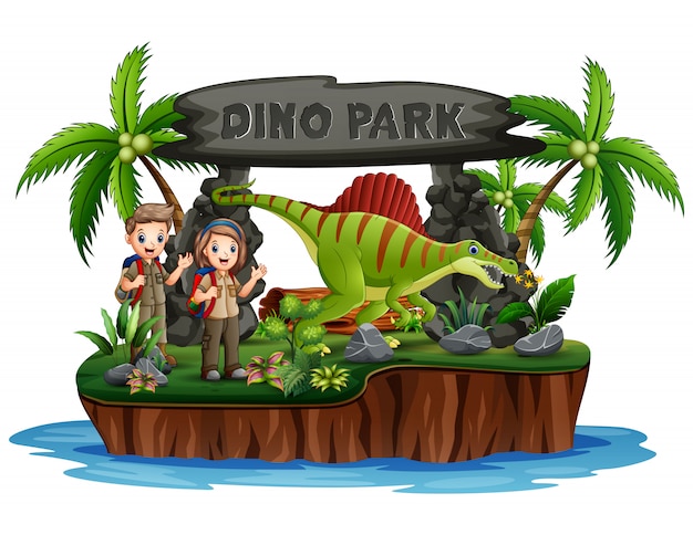 Scout boy and girl with dinosaurs in dino park