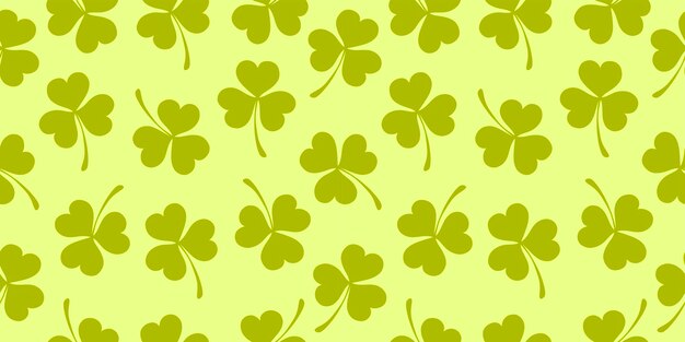 Seamless pattern of clover leaves Vector illustration light green background