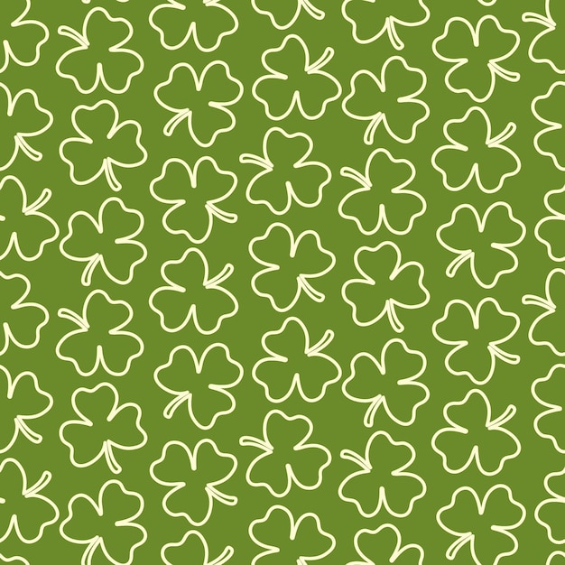 Seamless pattern of hand drawn, doodle Irish clover leaves, on isolated background.