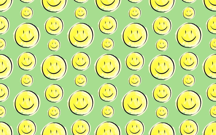 Vector seamless pattern the pattern emojis smiling yellow round icons for textiles and gift packages
