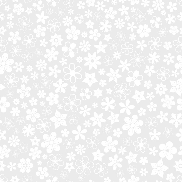 Seamless pattern of various small flowers in gray colors