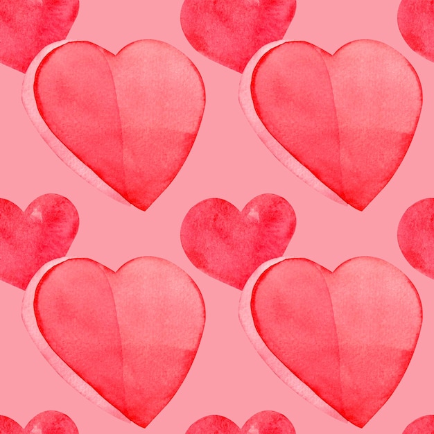 Seamless pattern with hand painted watercolor red hearts on pink background