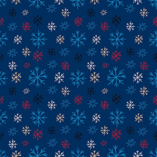 青い背景に白い雪片のシームレス パターン