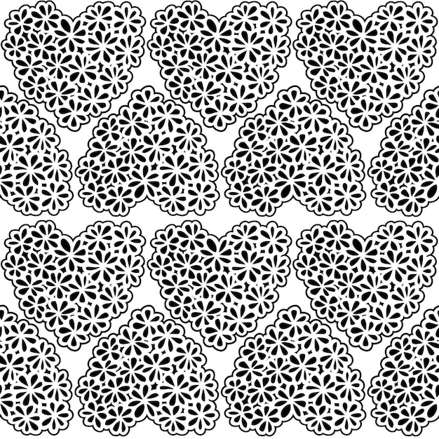 Seamless texture with white and black flower filled hearts.