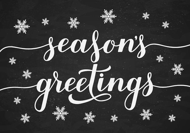 Vector season s greetings calligraphy hand lettering on chalkboard background with snowflakes christmas and new year typography poster easy to edit vector template for greeting card banner flyer etc