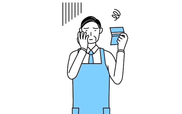 A senior man in an apron looking at his bankbook and feeling depressed