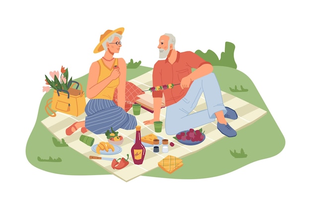 Senior man en vrouw op picknickdeken met eten