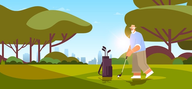 Senior man playing golf on green golf course aged player taking\
a shot active old age concept landscape background