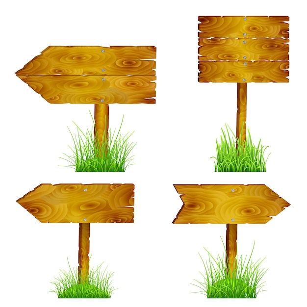 Set of blank wooden pointers directions in green grass