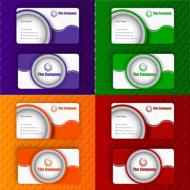 A set of business cards with different colors and the computer.