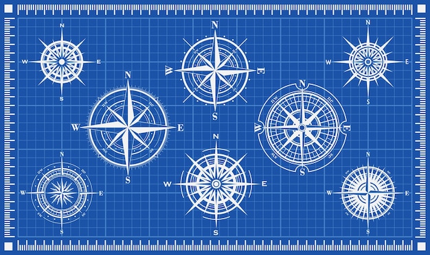 Set of compass roses or wind roses on blueprint background