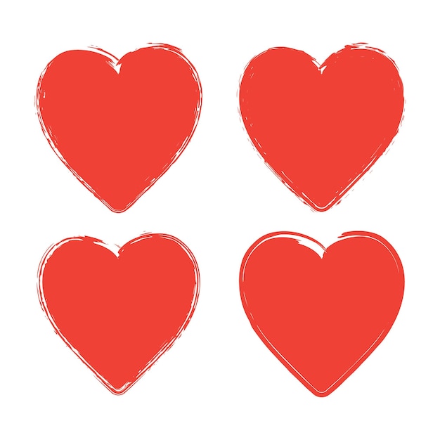 Set of four grunge red hearts on white background