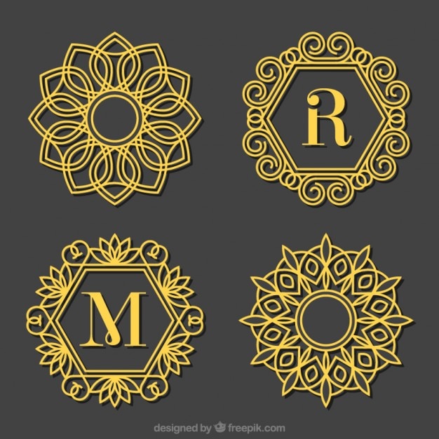 Set of golden ornamental capital letter logos