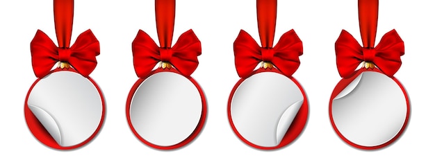 Set of holiday paper round label like christmas ball hanging on red ribbon with bow