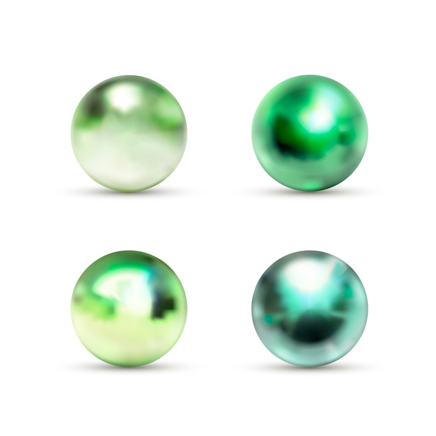 白のまぶしさと緑の光沢のある大理石のボールのセット